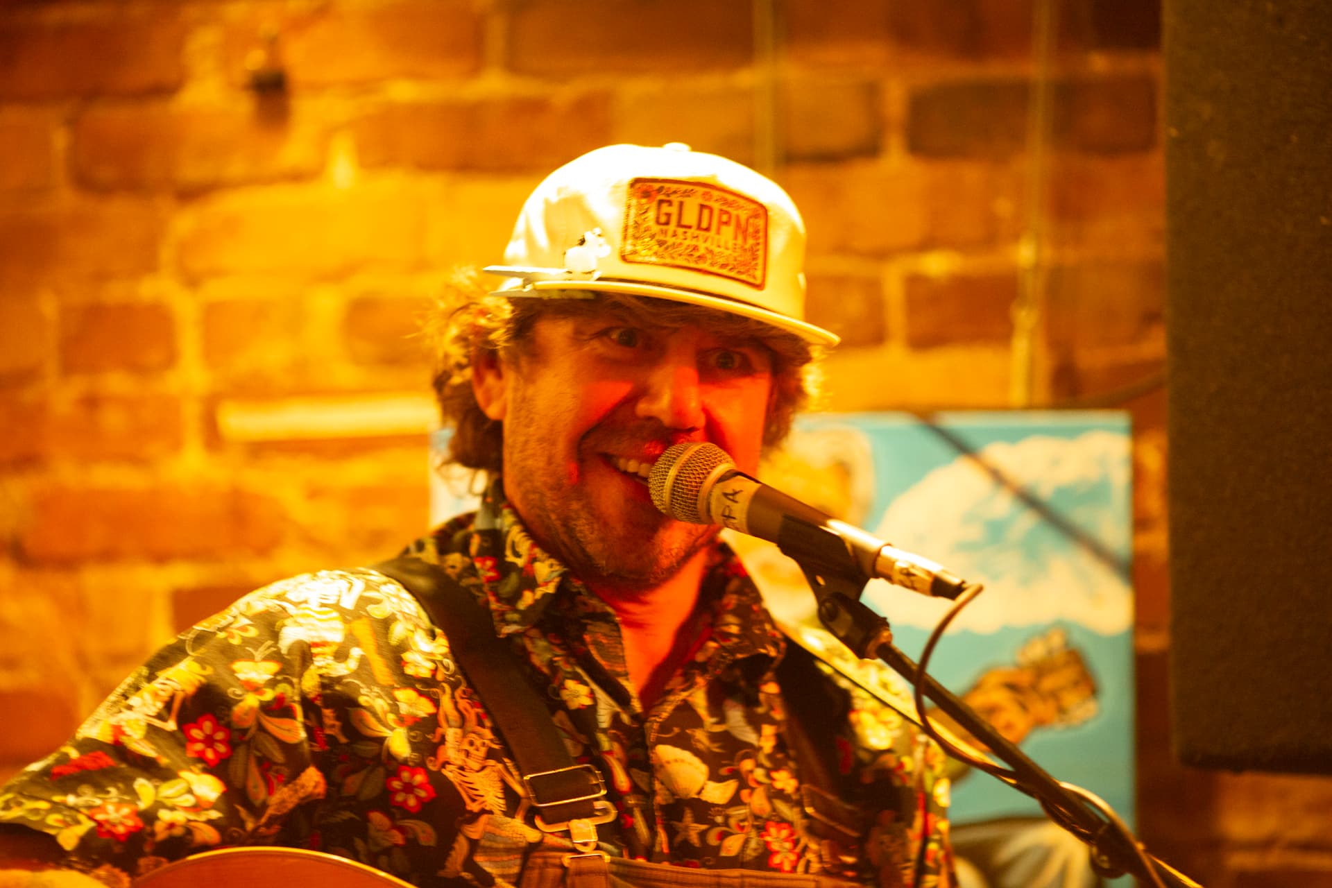 Close-up of Ty Stonehawker smiling at the mic